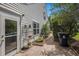 Exterior showcasing the backyard brick pathway, mature landscaping and side entry door at 1053 Williston Loop # 1053, Murrells Inlet, SC 29576