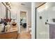 A stylish bathroom featuring a granite countertop vanity, frosted glass shower, and an entry view into the bedroom at 1053 Williston Loop # 1053, Murrells Inlet, SC 29576
