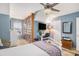 Bright bedroom featuring a bookcase, desk area, and white bed for a modern living space at 1053 Williston Loop # 1053, Murrells Inlet, SC 29576