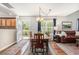 Inviting dining area with a wooden table, natural light, and a view into the living room at 1053 Williston Loop # 1053, Murrells Inlet, SC 29576