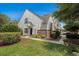 Charming townhome featuring white siding, brick accents, and professional landscaping at 1053 Williston Loop # 1053, Murrells Inlet, SC 29576