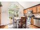 Well-lit kitchen with stainless steel appliances and a dining area with a large window at 1053 Williston Loop # 1053, Murrells Inlet, SC 29576