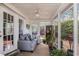 Cozy sunroom with comfortable seating, ceiling fan, and multiple windows offering bright natural light at 1053 Williston Loop # 1053, Murrells Inlet, SC 29576