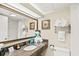 Bright bathroom featuring granite countertop, large mirror, and well-lit vanity at 1105 S Ocean Blvd. # 1048, Myrtle Beach, SC 29577