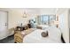 A beautifully designed bedroom boasts two cozy beds, modern amenities, and a balcony with scenic ocean views at 1105 S Ocean Blvd. # 1048, Myrtle Beach, SC 29577
