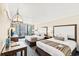 Inviting bedroom with two queen beds, stylish decor, and a private balcony offering stunning views at 1105 S Ocean Blvd. # 1048, Myrtle Beach, SC 29577