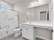 Accessible bathroom with marble-pattern shower curtain and comfort-height toilet at 1124 Valetto Loop, Myrtle Beach, SC 29579