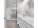 Bright bathroom featuring double vanity, large mirror, and a glass-enclosed shower at 1124 Valetto Loop, Myrtle Beach, SC 29579