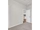 Cozy bedroom with carpet flooring; doorway shows a peek into the kitchen at 1124 Valetto Loop, Myrtle Beach, SC 29579