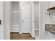 Mudroom entry with bench, coat hooks, and access to the kitchen at 1124 Valetto Loop, Myrtle Beach, SC 29579