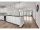 Open-concept kitchen featuring granite countertops, stainless steel appliances, and stylish pendant lighting at 1124 Valetto Loop, Myrtle Beach, SC 29579