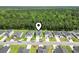 Aerial view of houses in neighborhood with lawns, trees, streets, and a lake at 1146 Joywood Dr., Longs, SC 29568