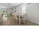 Bright dining area with a table set for six, complemented by sliding glass doors to the outside at 1146 Joywood Dr., Longs, SC 29568