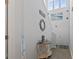 Bright foyer with a stairway featuring an attractive table, decor, and beach themed wall decorations at 1146 Joywood Dr., Longs, SC 29568