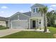 Charming home featuring a two-car garage, palm tree, and well-maintained lawn at 1146 Joywood Dr., Longs, SC 29568