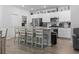 Modern kitchen featuring white cabinets, stainless steel appliances, and a spacious island with seating at 1146 Joywood Dr., Longs, SC 29568