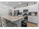 Bright kitchen featuring stainless steel appliances, granite countertops, an island with seating, and modern finishes at 1146 Joywood Dr., Longs, SC 29568