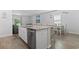 Well-lit kitchen featuring an island with barstool seating and modern stainless-steel appliances at 1146 Joywood Dr., Longs, SC 29568