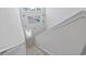 Bright staircase features neutral carpeted stairs, modern white railing, and coastal-themed wall decor at 1146 Joywood Dr., Longs, SC 29568
