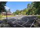 Full-sized community basketball court with manicured landscaping and a community clubhouse in the background at 1196 Harvester Circle # 1196, Myrtle Beach, SC 29579