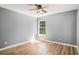 Bright bedroom featuring wood floors, a ceiling fan, and a window allowing natural light at 1196 Harvester Circle # 1196, Myrtle Beach, SC 29579