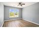 Bright bedroom with wood floors and large window overlooking the outdoors at 1196 Harvester Circle # 1196, Myrtle Beach, SC 29579