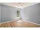 Bedroom featuring wood floors, a ceiling fan, and a window allowing natural light at 1196 Harvester Circle # 1196, Myrtle Beach, SC 29579