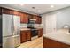 Kitchen with stainless steel appliances, wood cabinets, subway tile backsplash, and stone countertops at 1196 Harvester Circle # 1196, Myrtle Beach, SC 29579