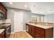 Cozy kitchen with stainless steel appliances, wood cabinets and bar-top dining at 1196 Harvester Circle # 1196, Myrtle Beach, SC 29579