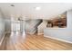 Large open-concept living area with wood floors, neutral walls, and views of the kitchen at 1196 Harvester Circle # 1196, Myrtle Beach, SC 29579