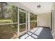 Inviting screened porch with views of the backyard and surrounding greenery at 1196 Harvester Circle # 1196, Myrtle Beach, SC 29579