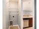 Functional utility room with shelving and appliances, located adjacent to the kitchen at 1196 Harvester Circle # 1196, Myrtle Beach, SC 29579