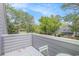Balcony with wooded views, table, and chairs, perfect for enjoying the outdoors at 1206 Erin Way # A, Myrtle Beach, SC 29577