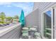 Balcony with table, chairs, and umbrella, offers outdoor space for relaxation at 1206 Erin Way # A, Myrtle Beach, SC 29577