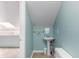 Upstairs bathroom features a pedestal sink and a toilet at 1206 Erin Way # A, Myrtle Beach, SC 29577