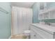 Bathroom features a white shower curtain, toilet, vanity, and mirror at 1206 Erin Way # A, Myrtle Beach, SC 29577