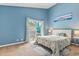Bright bedroom with a sliding glass door, light walls, and an inviting atmosphere at 1206 Erin Way # A, Myrtle Beach, SC 29577