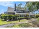 Charming two-story home with mature landscaping, gray siding, and a well-maintained front yard at 1206 Erin Way # A, Myrtle Beach, SC 29577