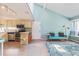 Open living space featuring a kitchen, breakfast bar, cozy couch, and bright natural light at 1206 Erin Way # A, Myrtle Beach, SC 29577