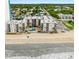 Aerial shot highlighting the building's beachfront location, pool, and ocean views at 1310 N Waccamaw Dr. # 204, Garden City Beach, SC 29576
