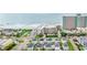 Stunning aerial view showcasing beachside condos, the ocean and colorful beach homes at 1310 N Waccamaw Dr. # 204, Garden City Beach, SC 29576