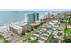 An aerial view showcasing the oceanfront community with colorful houses and easy beach access at 1310 N Waccamaw Dr. # 204, Garden City Beach, SC 29576