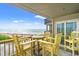 Charming balcony with bright furniture and stunning ocean views at 1310 N Waccamaw Dr. # 204, Garden City Beach, SC 29576