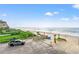 Expansive view of the beach, ocean, and coastline; a beautiful landscape from a high vantage point at 1310 N Waccamaw Dr. # 204, Garden City Beach, SC 29576