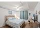 Relaxing bedroom with beach-themed decor, ceiling fan, and a comfortable bed for a restful night's sleep at 1310 N Waccamaw Dr. # 204, Garden City Beach, SC 29576