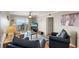 Bright living room with ocean views and a sliding glass door to the balcony at 1310 N Waccamaw Dr. # 204, Garden City Beach, SC 29576