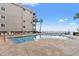 Swimming pool offering views of the ocean and palm trees at 1310 N Waccamaw Dr. # 204, Garden City Beach, SC 29576