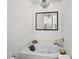 Bright bathroom featuring a tub with jets, a chandelier, and a mirror over the tub at 160 Cart Crossing Dr. # 104, Conway, SC 29526