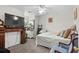 A cozy bedroom with a decorative fireplace and flat screen TV at 160 Cart Crossing Dr. # 104, Conway, SC 29526