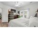 Cozy bedroom showcasing a comfortable bed, storage, natural light, and hardwood floors for a welcoming space at 160 Cart Crossing Dr. # 104, Conway, SC 29526